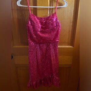 Pink sparkly Amazon dress with ruffles at bottom and ties in the back